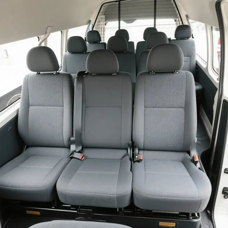 Toyota Hiace 12-seater van - real photos you provided. Left: High-roof cabin interior with 11 grey passenger seats. Right: Massive open boot at Auckland Airport Terminal 3 loaded with 10+ suitcases, golf bags (Callaway & Titleist), stroller and luggage.